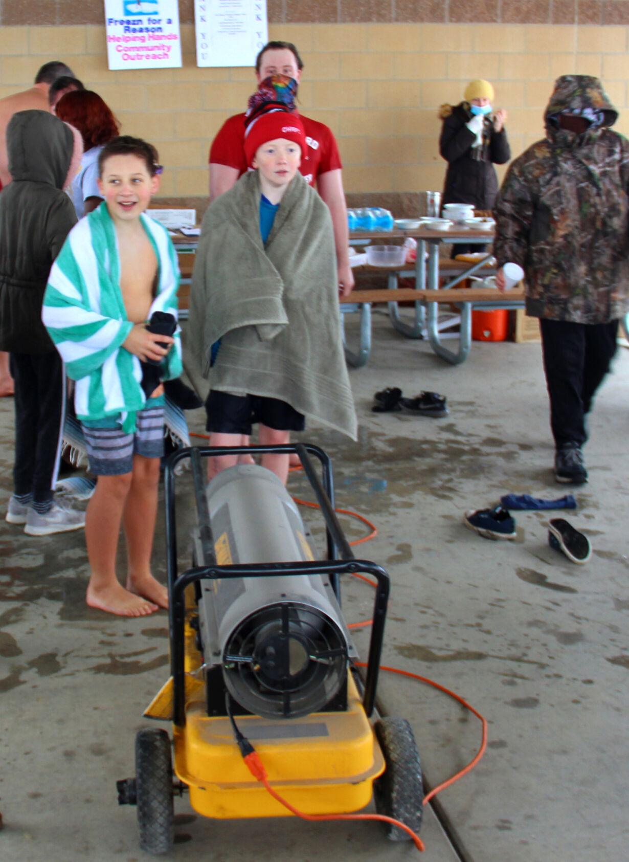 Children Gather Around a Heater